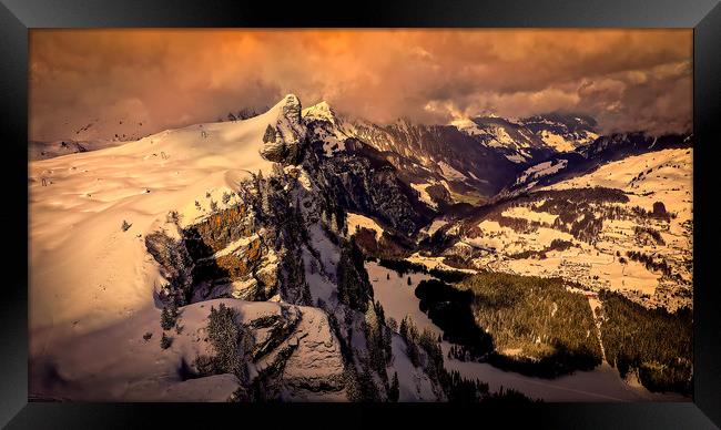 Flight over snow-capped mountains in the Swiss Alp Framed Print by Erik Lattwein