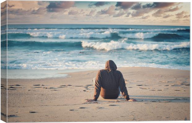  shot of a male in a black jacket on the beach Canvas Print by federico stevanin