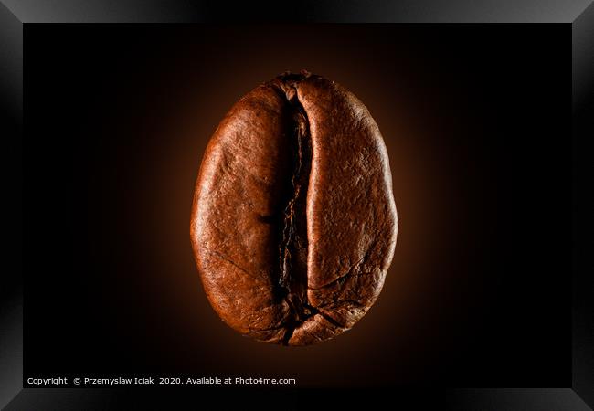 Single coffee bean against black background Framed Print by Przemek Iciak
