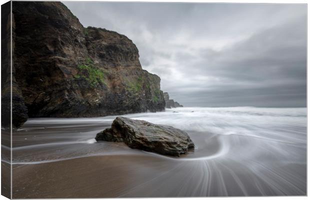 Tide around rock, Whipsiderry Beach Canvas Print by Mick Blakey