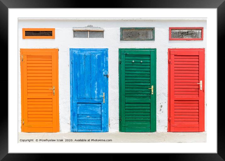 Colourful doors painted in orange, blue, green and Framed Mounted Print by Przemek Iciak