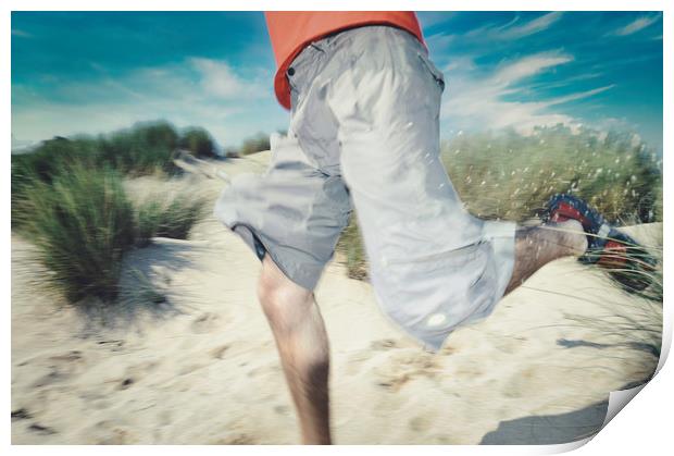 blurry photo of man legs running through sand Print by federico stevanin
