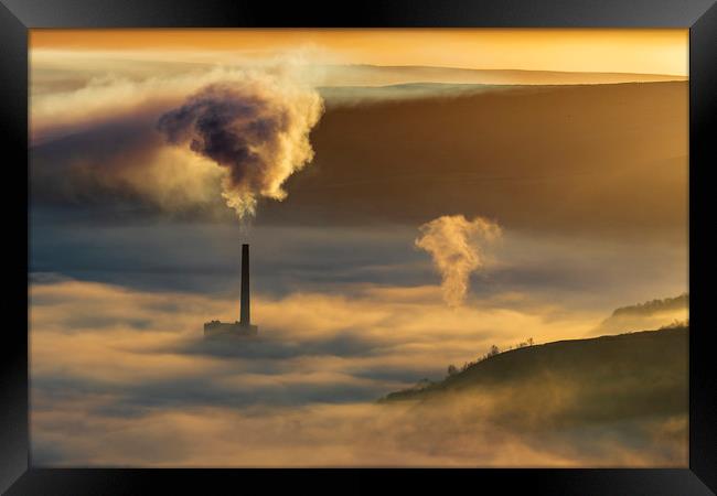 Smoke above Fog at sunrise Framed Print by John Finney