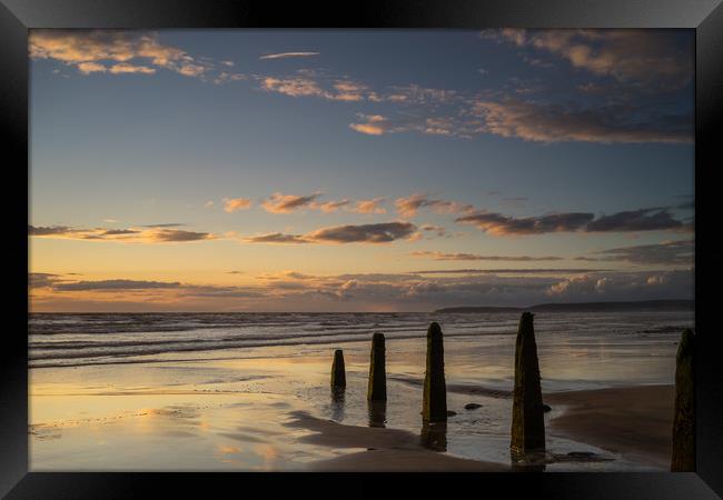 Sunset beach Groynes Framed Print by Tony Twyman