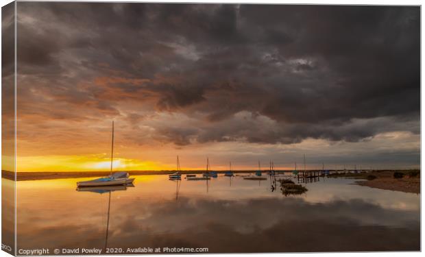 Sunset under the clouds at Blakeney Canvas Print by David Powley