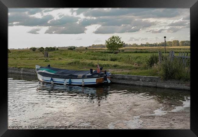 Moored on Thurne Dyke at dusk Framed Print by Chris Yaxley