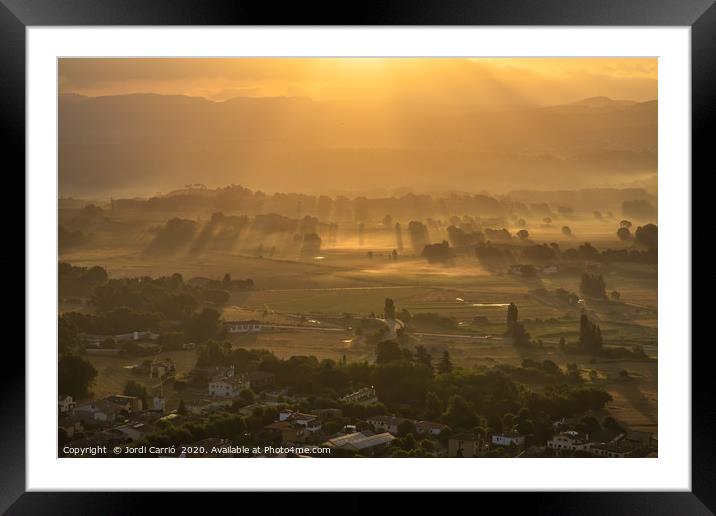 Sunbeams and haze in the valley Framed Mounted Print by Jordi Carrio