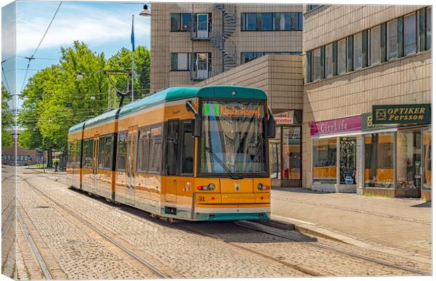Norrkoping Passing Tram Car Canvas Print by Antony McAulay