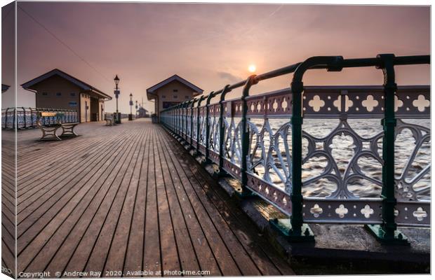 Rising sun from Penarth Pier Canvas Print by Andrew Ray