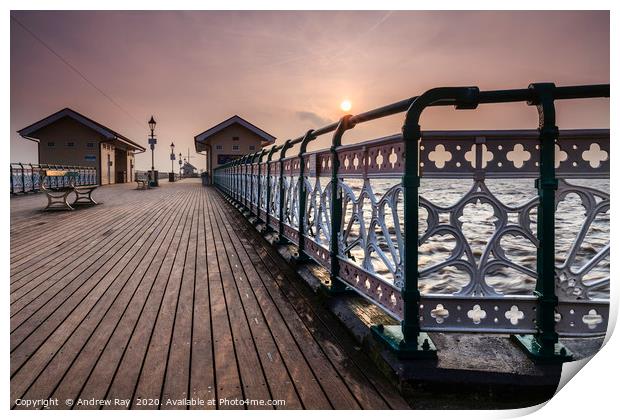 Rising sun from Penarth Pier Print by Andrew Ray