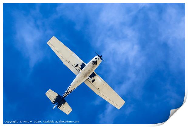 Small Aeroplane with blue sky and light clouds Print by Miro V