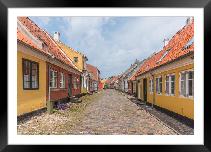 an idyllic street with cobblestone and old houses  Framed Mounted Print by Stig Alenäs