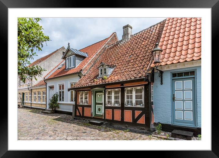 A romantic fairytale halftimbered house on a cobbl Framed Mounted Print by Stig Alenäs