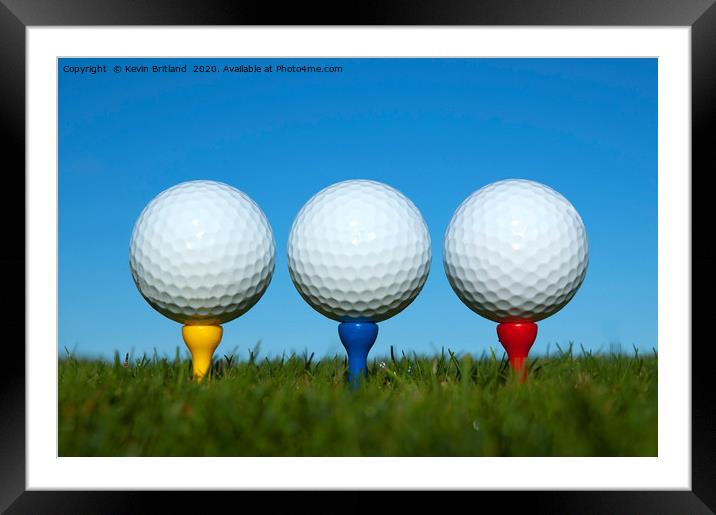 golf balls on tees Framed Mounted Print by Kevin Britland