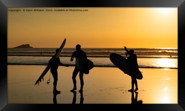Surfers at sunset Framed Print by Kevin Britland