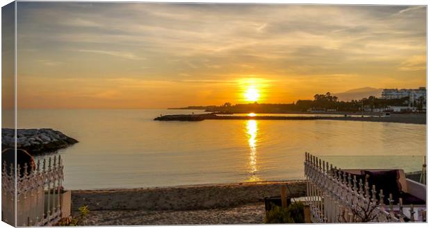 Puerto Banus beach at sunset Canvas Print by Naylor's Photography