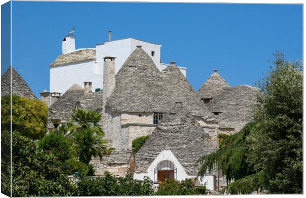 Enchanting Trulli Village in Italy Canvas Print by Simon Marlow
