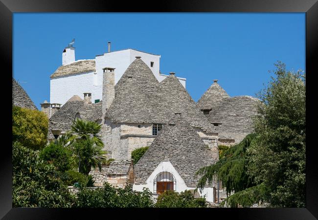 Enchanting Trulli Village in Italy Framed Print by Simon Marlow