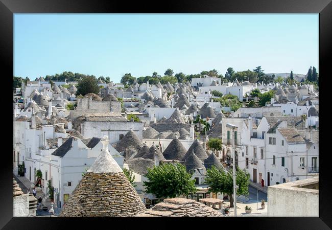 Enchanting Conical Trulli Village Framed Print by Simon Marlow