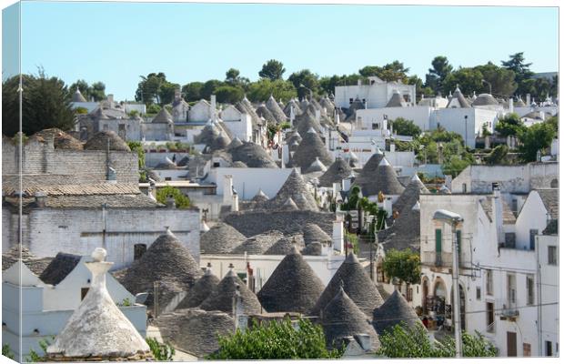 Traditional Trulli houses in Alberobello Canvas Print by Simon Marlow