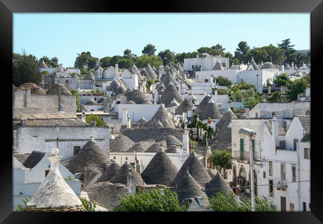 Traditional Trulli houses in Alberobello Framed Print by Simon Marlow