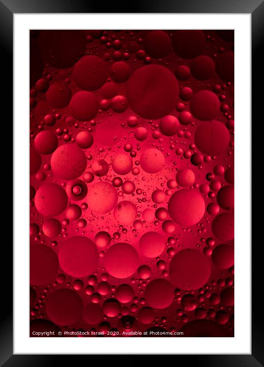 Red 'moon craters' ball Framed Mounted Print by PhotoStock Israel