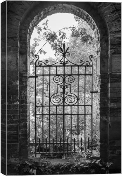 Old gate in an English walled garden Canvas Print by Andrew Kearton