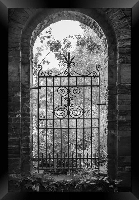 Old gate in an English walled garden Framed Print by Andrew Kearton