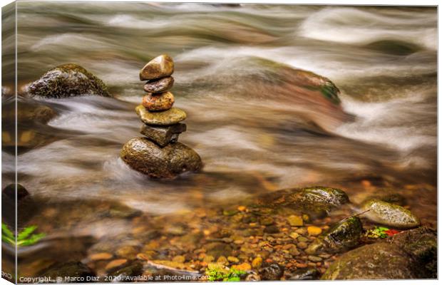 Stones in a zen position in a river in Costa Rica Canvas Print by Marco Diaz