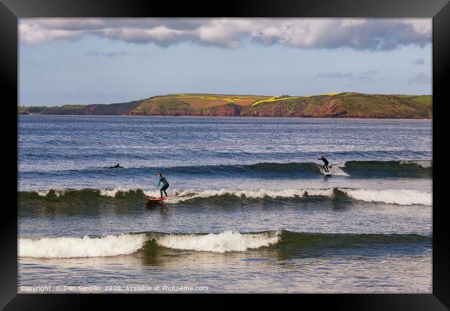 Surfing at Manorbier in Pembrokeshire Framed Print by Dan Santillo