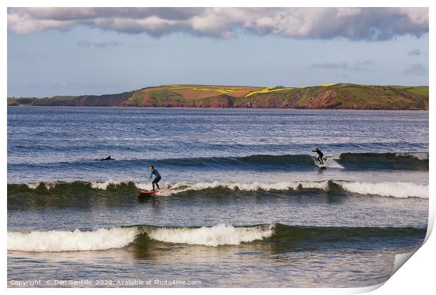 Surfing at Manorbier in Pembrokeshire Print by Dan Santillo