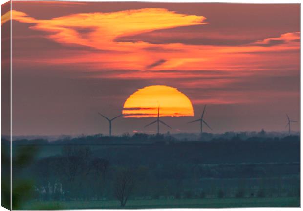Sunset behind Tick Fen windfarm 11th April 2019 Canvas Print by Andrew Sharpe