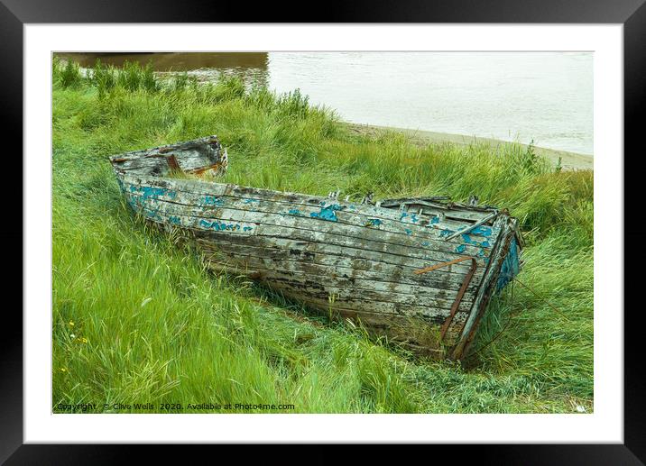 Old wrecked rowing boat at King`s Lynn in Norfolk Framed Mounted Print by Clive Wells