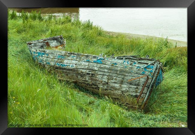 Old wrecked rowing boat at King`s Lynn in Norfolk Framed Print by Clive Wells