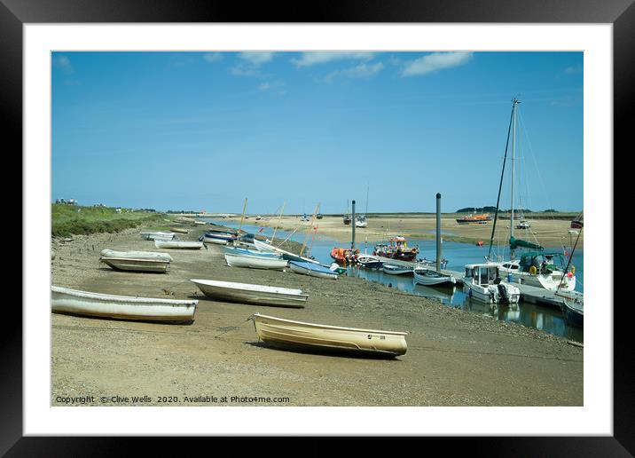 Rowing boats at low tide seen at Wells-Next-Sea in Framed Mounted Print by Clive Wells