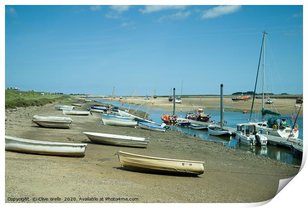 Rowing boats at low tide seen at Wells-Next-Sea in Print by Clive Wells