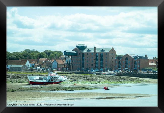Wells-Next-Sea seen at low tide Framed Print by Clive Wells