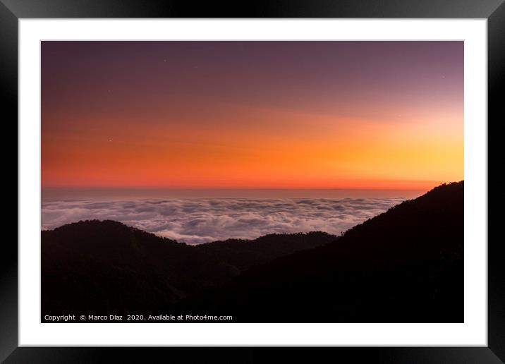 Sunset and sea of clouds Framed Mounted Print by Marco Diaz