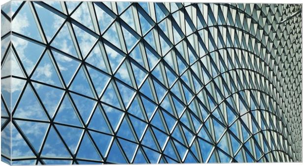  Symmetrical abstract shapes of a steel glass roof Canvas Print by Hanif Setiawan
