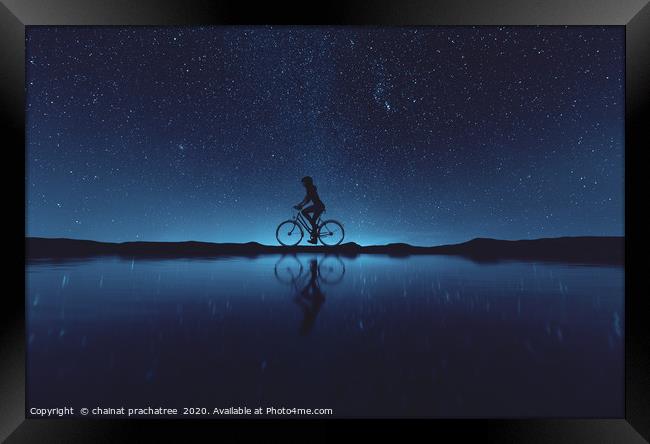 Silhouette of young woman cyclist at night sky,3d  Framed Print by chainat prachatree