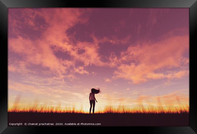 Woman walking alone at sunset,3d rendering Framed Print by chainat prachatree