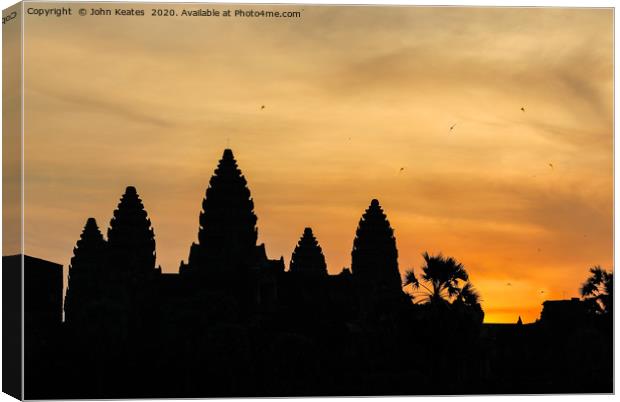 Sun rise at the Angkor Wat temple, Cambodia Canvas Print by John Keates