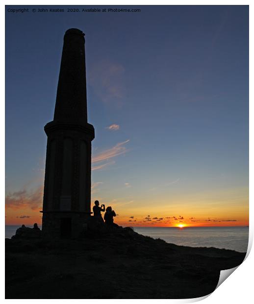 A couple taking a photograph of the setting sun at Print by John Keates