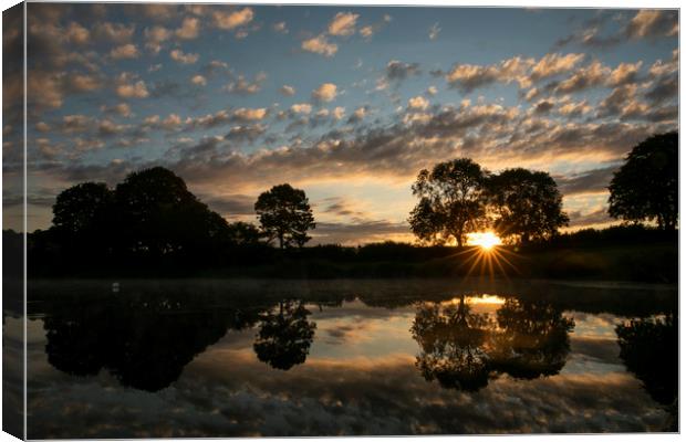 Sunrise over Sywell Country Park Canvas Print by Leila Coker