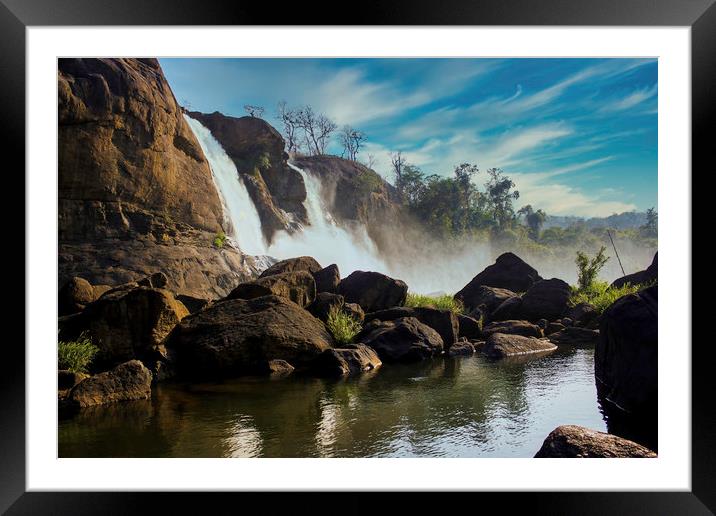 A landscape view of a waterfall named Athirapally Framed Mounted Print by Arpan Bhatia