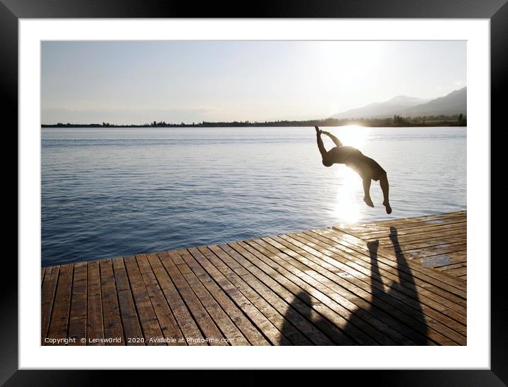 Boy jumping in a lake Framed Mounted Print by Lensw0rld 