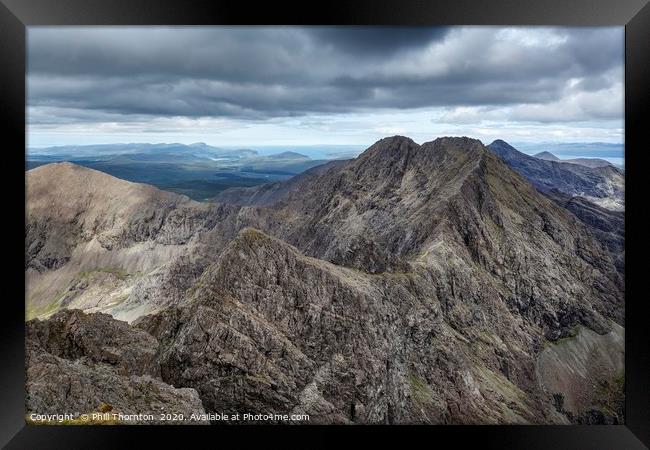 Looking north along the Black Cuillin ridge.  Framed Print by Phill Thornton