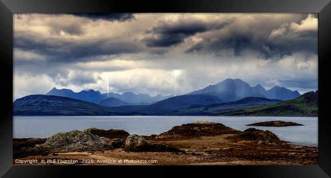 Storm clouds over the  Black & Red Cuillins. Framed Print by Phill Thornton
