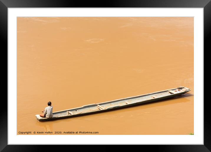 Man in boat on the Mekhong River  Framed Mounted Print by Kevin Hellon