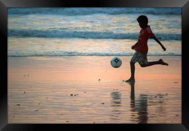 Kid playing in Goa beach Framed Print by Arpan Bhatia